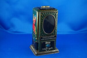 Tell Schokolade Spardose | Blech Spar-Automat Hartwig & Vogel A.G. um ca. 1920-1930